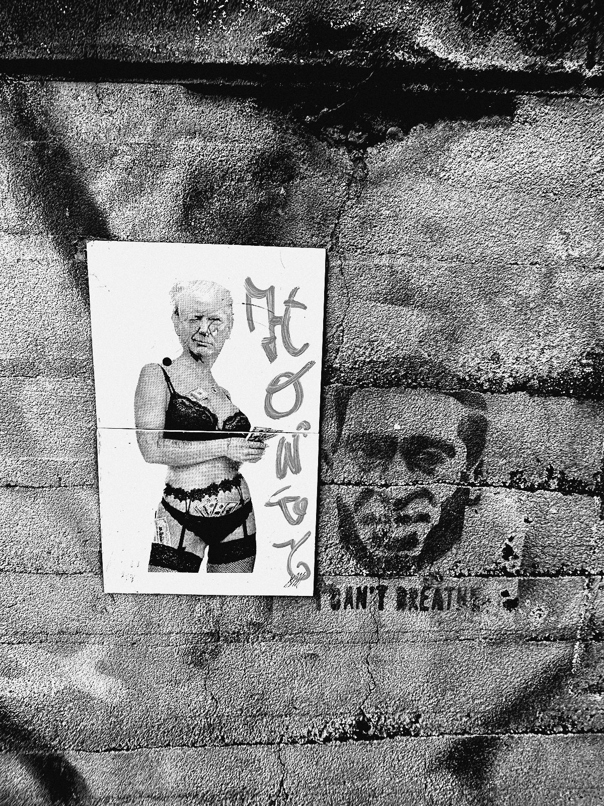 Paste-up neben Can't-Breathe-Schablone an Betonwand